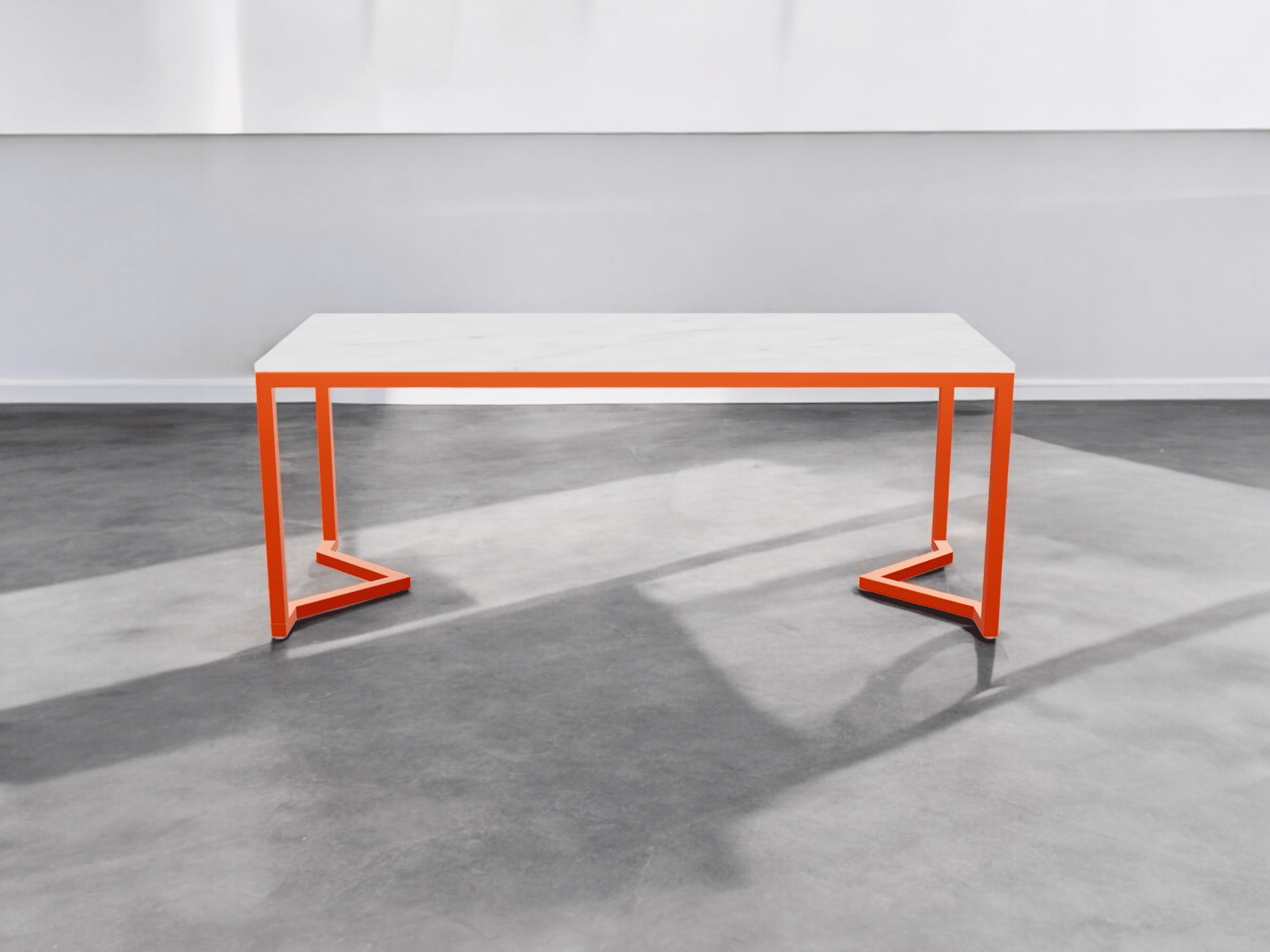 Table moderne blanche avec cadre orange vif.